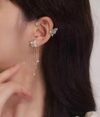 Boucles d'oreilles pendantes papillon à pompon et zircon